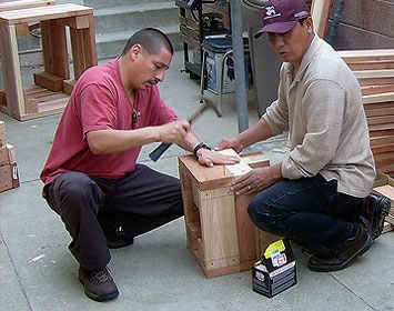 Working together on sidewalk "living room" furniture to enhance the community. 